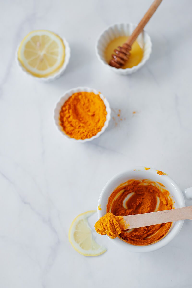 mix together ingredients for  homemade turmeric face mask